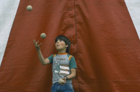 CHILDREN, Playing, Child juggling three balls.