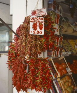 ITALY, Campania, Amalfi, "Via Genova, Main Street. Dried Chilli peppers hanging outside a shop.