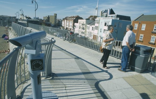 ENGLAND, Hampshire, Portsmouth, Old Portsmouth. People standing on path leading to the Square Tower