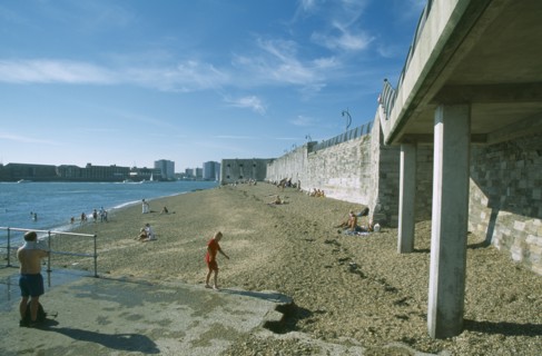 ENGLAND, Hampshire, Portsmouth, Old Portsmouth. Occupied strectch of beach next to the Walls