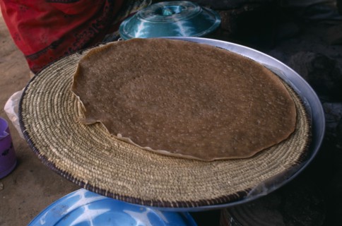 ERITREA, Asmara, "Deda camp for people displaced by war with Ethiopia.  Cooking injera a type of