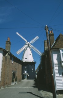 ENGLAND, Kent, Cranbrook, Road leading to Windmill with houses either side.