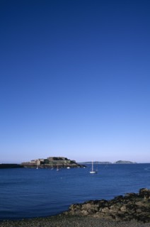 UNITED KINGDOM, Channel Islands, Guernsey, St Peter port. Castle Cornet seen from across water.