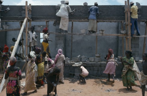 SOMALIA, Construction, Settled nomads building houses.