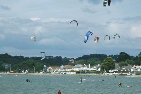ENGLAND, Dorset, Sandbanks, Poole Harbour. Kite Surfing