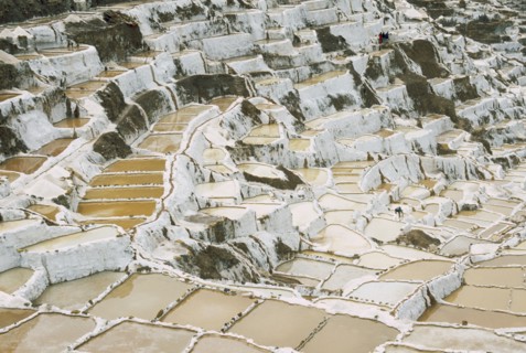 PERU, Cusco, Salineras, People working on the Salt Mines dating back to Inca times. Near Urubamba.