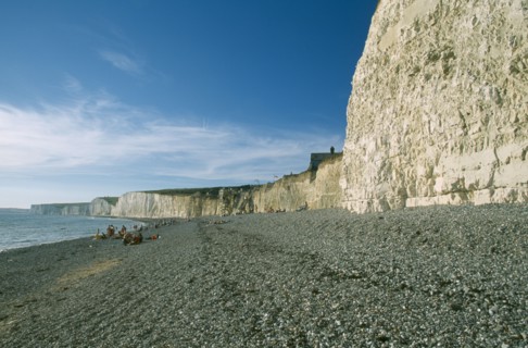 ENGLAND, East Sussex, Birling Gap, Peeble beach and a long section of cliff face.