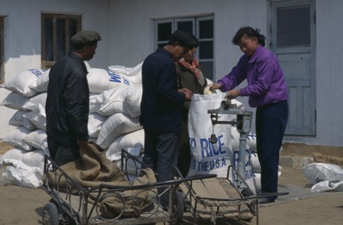 NORTH KOREA, N. Pyongan Province, Uiju County, WFP rice distribution to farmers affected by