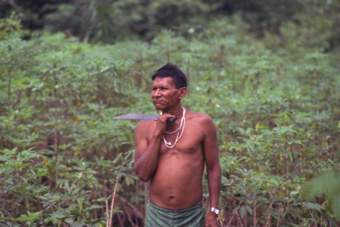 COLOMBIA, Vaupes , "Tukano indian shaman, with machete and chewing coca."