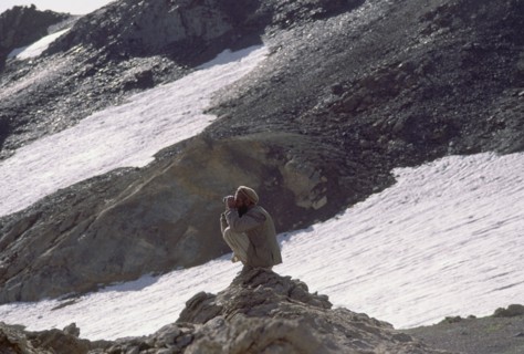 PAKISTAN, North West Frontier Province, Chitral, Hill tribe hunter with Tirich Mir in the