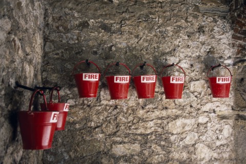 UNITED KINGDOM, Channel Islands, Guernsey, St Peter Port. Castle Cornet. Red fire sand buckets