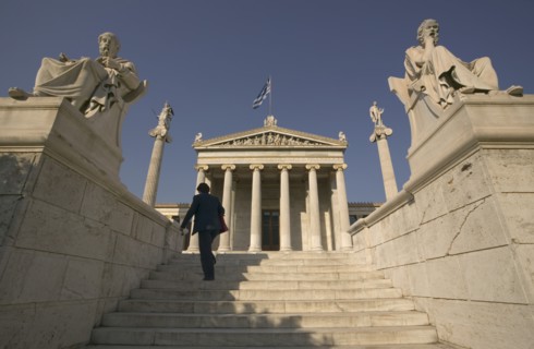 GREECE, Central, Athens, A lady walking up the steps leading to the Numismatic Museum.