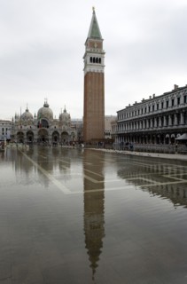 ITALY, Veneto, Venice, Aqua Alta High Water flooding in St Marks Square with St marks Basilica and