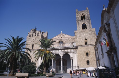 ITALY, Sicily, Palermo, Monreale. II Duomo Norman Cathedral exterior with people walking on road