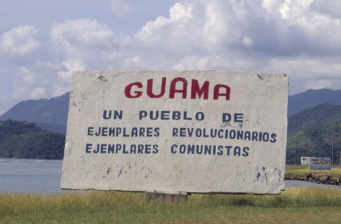 CUBA, Guama, "Sign welcoming people to the town, including revolutionary writings."