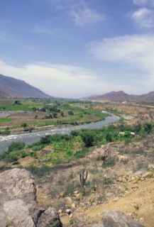PERU, Northern, River and flood plain in background on road from Cajamarca to Chiclayo.
