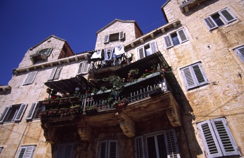 CROATIA, Dalamatia, Brac, Bol village house with balcony. The old village of Bol on the southern