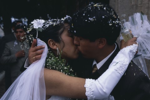 BOLIVIA, La Paz, Wedding in El Monticulo. Bride and Groom kissing.