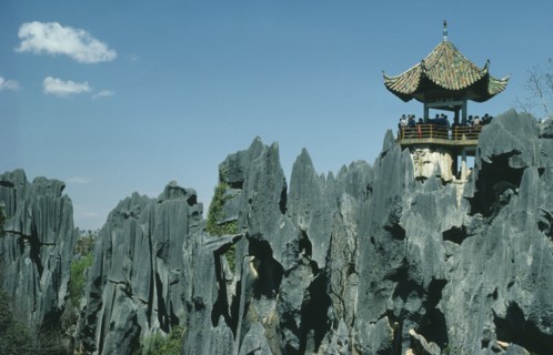 CHINA, Yunnan Province, Shilin, The Stone Forest. Grey limestone rock pinnacles with tourists