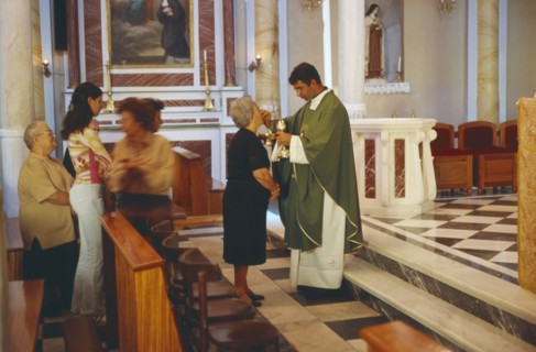 GREECE, Cyclades Islands, Syros, Ermoupolis. A Catholic service performed at the Church of Ag.