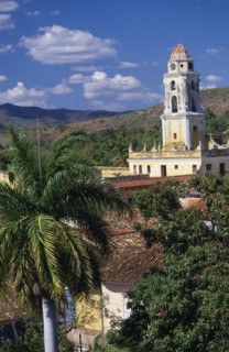 CUBA, Trinidad, Iglesia San Franciso de Paula roof and bell tower with red tiled rooftops and palm