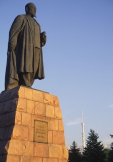 KAZAKHSTAN, Almaty, "Statue of Lenin, with telecommunications tower in background."