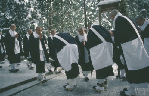 JAPAN, Honshu, Kii Peninsula, Mount Koya-san.  Venerated Shingon-Buddhist site.  Group of monks bow