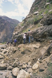PERU, Cordillera Balnca, Huaraz, Workers clearing a land slide.