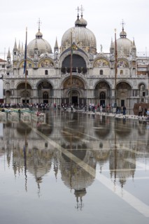 ITALY, Veneto, Venice, Aqua Alta High Water flooding in St Marks Square showing St Marks Basilica