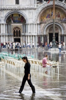 ITALY, Veneto, Venice, Aqua Alta High Water flooding in St Marks Square showing St Marks Basilica