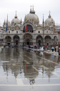 ITALY, Veneto, Venice, Aqua Alta High Water flooding in St Marks Square showing St Marks Basilica