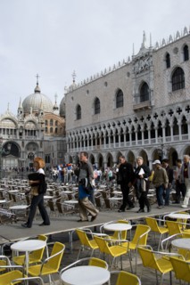 ITALY, Veneto, Venice, Aqua Alta High Water flooding in St Marks Square with tourists walking on an