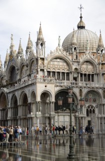 ITALY, Veneto, Venice, Aqua Alta High Water flooding in St Marks Square with tourists walking on