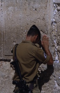 ISRAEL, Jerusalem, An Israeli Soldier in army uniform with an M16 Assault Riffle over his shoulder