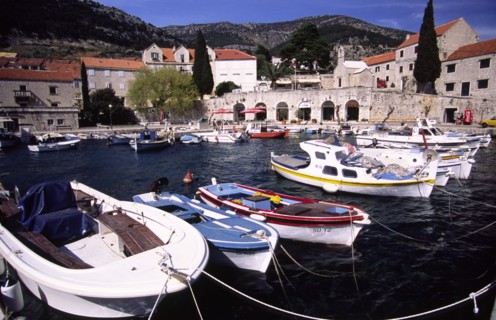 CROATIA, Dalmatia, Brac, "Bol marina nestled beneath Vidova Gora mountain ridge on the south side