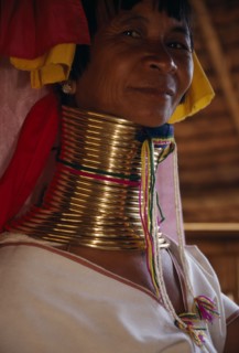 THAILAND, Chiang Rai Province, Mae Chan, Head and shoulders portrait of Paduang ‘long neck’ woman