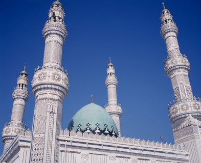 KUWAIT, Kuwait City, Iranian Mosque.  Part view of highly decorated facade of mosque showing domed