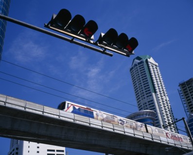 THAILAND, Bangkok, "Looking up at skytrain, traffic lights and high rise commercial building."