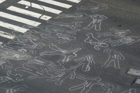 VENEZUELA, Caracas, Chalk outlines with the names of participants in an event on Avenida Francisco