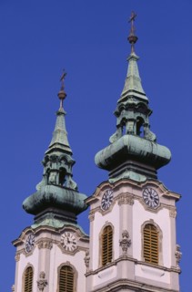 HUNGARY, Budapest, Church of St Anne in Batthyany Square.  Detail of twin clock towers with copper