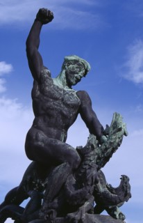 HUNGARY, Budapest, Gellert Hill.  Detail of statue of male figure slaying a multi headed serpant.