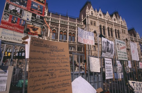 HUNGARY, Budapest, "Hand-written posters and signs attached to railings outside Parliament to