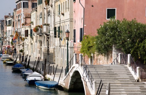 ITALY, Veneto, Venice, A bridge and colourful houses beside a canal on Fondamente della Sensa in