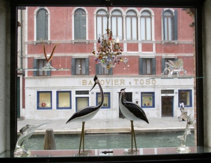 ITALY, Veneto, Venice, Glass display of birds and other objects in a window on Fondamente dei