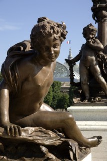 FRANCE, Ile de France, Paris, Art Nouveau cherubs on a lamp-post on Ponte Alexandre III bridge