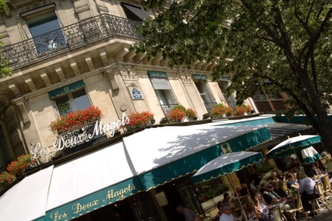 FRANCE, Ile de France, Paris, People at pavement tables outside Les Deux Magots the famous literary