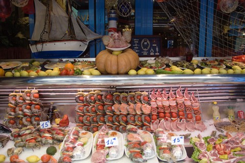 FRANCE, Ile de France, Paris, Greek restaurant window display in the Latin Quarter showing seafood
