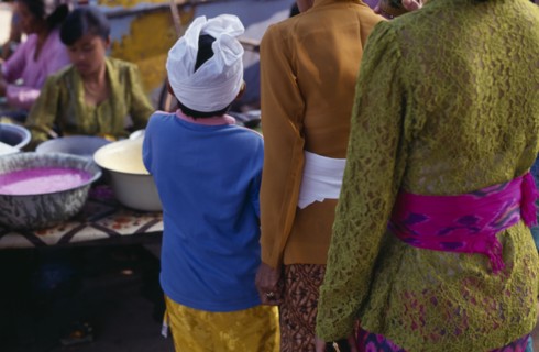 INDONESIA, Bali, Traditional Dress, Cropped view from behind of young boy in traditional dress