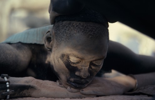 SUDAN, Rumbek, Dinka youth having hair bleached with cattle urine in Majak Asok cattle camp.