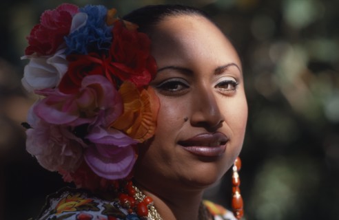 MEXICO, Yucatan, Chichen Itza, Head and shoulders portrait of female singer and dancer wearing silk